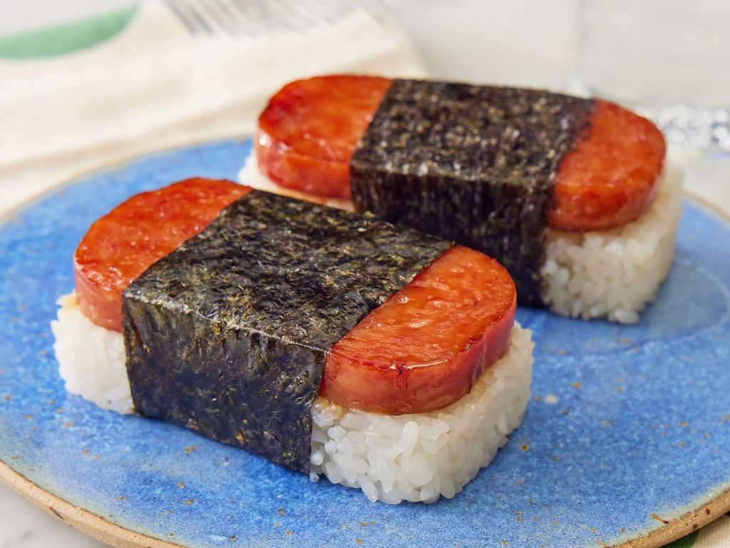 Two Spam musubis on a blue plate.